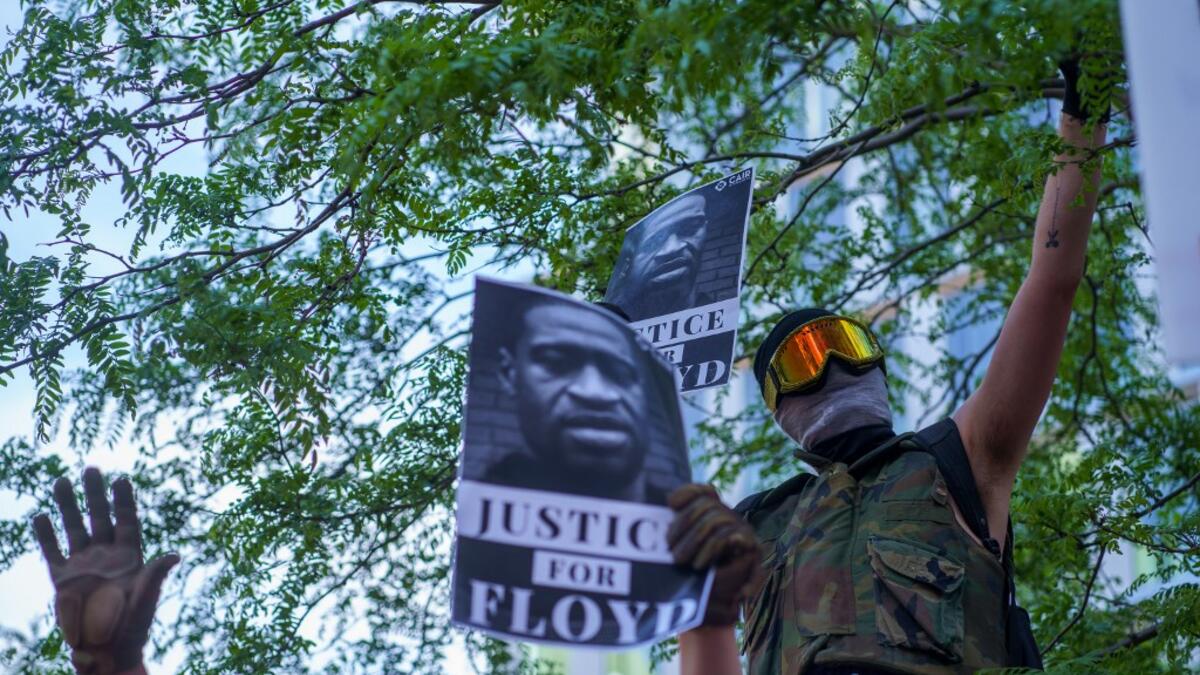 Protesters gather in a call for justice for George Floyd, a black man who died after a white policeman kneeled on his neck for several minutes, at Hennepin County Government Plaza, on May 28, 2020 in Minneapolis, Minnesota. kerem yucel / AFP
