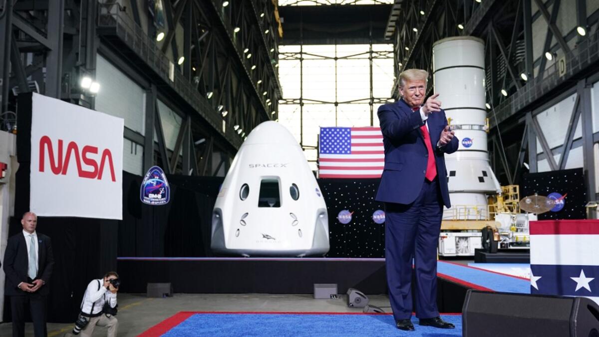 US President Donald Trump arrives to speak after the launch of the SpaceX Falcon 9 rocket and Crew Dragon spacecraft on NASA's SpaceX Demo-2 mission to the International Space Station from NASA's Kennedy Space Center in Cape Canaveral, Florida on May 30, 2020. Trump travels to Kennedy Space Center in Florida to watch the launch of the MANDEL NGAN / AFP