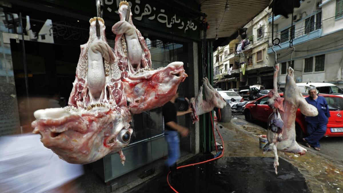 Sheep heads hang outside a butcher's shop in the Bab al-Tabbaneh neighbourhood of Lebanon's northern city of Tripoli on June 3, 2020. Thousands of residents of Lebanon's northern Tripoli struggle to put food on the table, as the country's worst economic crisis in decades has picked up in speed in recent weeks, with food prices rising by more than 70 percent since the autumn. Inflation has been a blow in the country where more than 45 percent of the country's population now lives below the poverty line, and