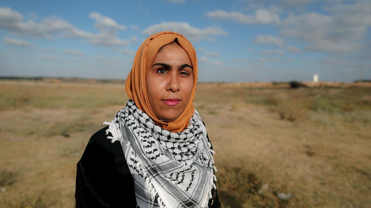Mai Abu Rawda, who lost her right eye, stands at the place where she was shot in Bureij refugee camp in central Gaza, on May 28 , 2020. Along the border of the Gaza Strip, the Israeli army uses snipers who, according to instructions, open fire only when the soldiers are at risk from intensifying violence from Palestinian rioters. Some were taking part in clashes, others simply in the wrong place at the wrong time. All were left scarred and their lives wrecked, even though in Palestinian society being injure