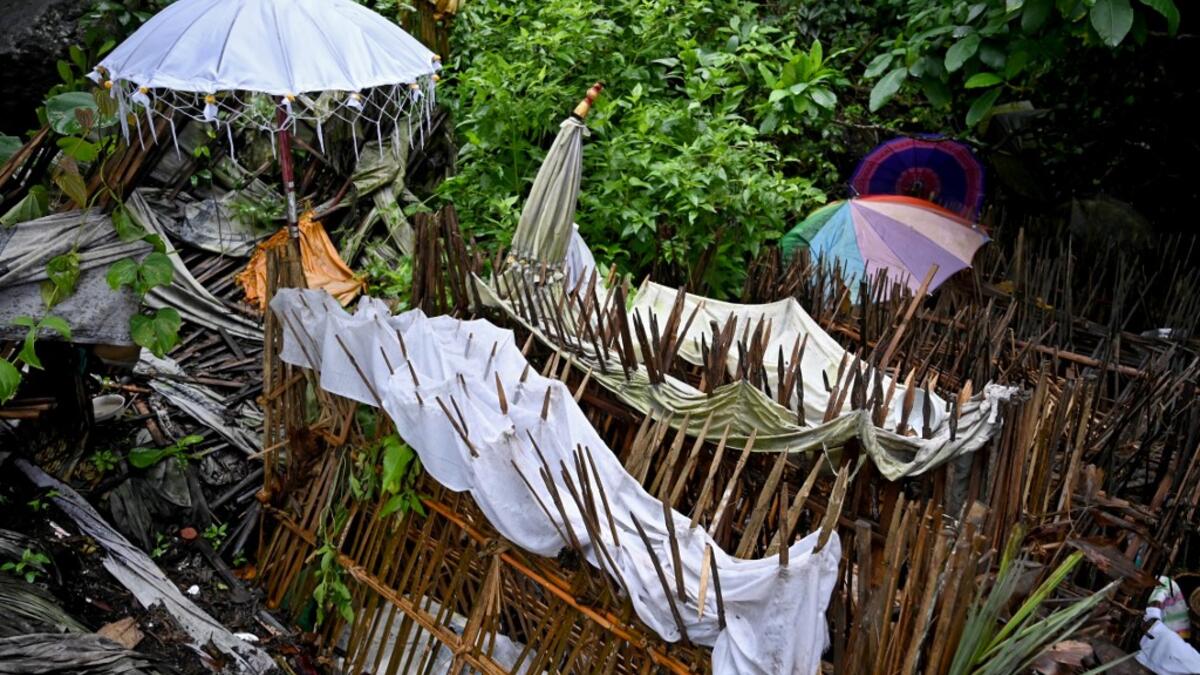 This picture taken on February 20, 2020 shows bamboo cages which cover bodies at a cemetery where Bali's Trunyanese people hold open-air burials - before restrictions were implemented due to the COVID-19 coronavirus - near the village of Trunyan in Bangli Regency, near Lake Batur on Bali island. SONNY TUMBELAKA / AFP