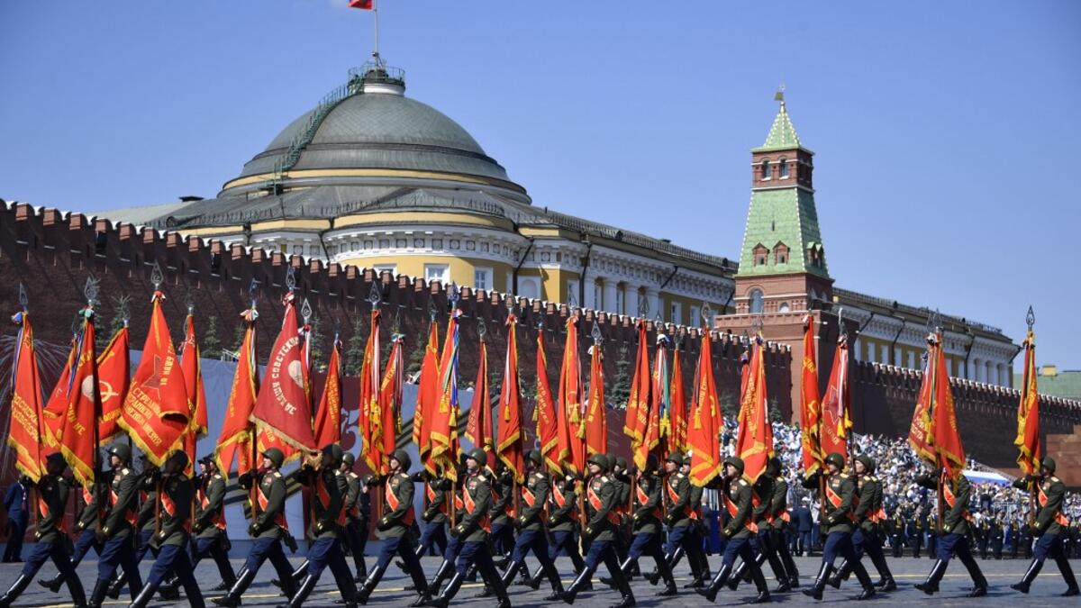 Servicemen in historical uniforms march on Red Square during a military parade, which marks the 75th anniversary of the Soviet victory over Nazi Germany in World War Two, in Moscow on June 24, 2020. The parade, usually held on May 9, was postponed this year because of the coronavirus pandemic. Alexander NEMENOV / AFP