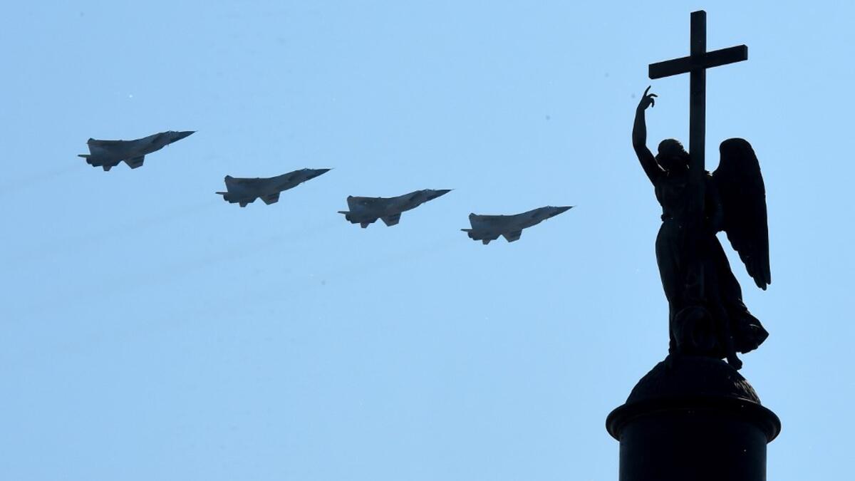 Russian military jets fly over Dvortsovaya Square during a military parade, which marks the 75th anniversary of the Soviet victory over Nazi Germany in World War Two, in Saint Petersburg on June 24, 2020. The parade, usually held on May 9, was postponed this year because of the coronavirus pandemic. OLGA MALTSEVA / AFP
