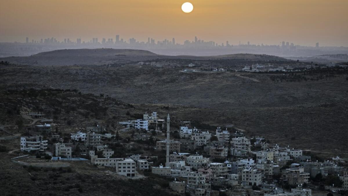 A picture taken from the Israeli settlement of Naale in the occupied West Bank northwest of the Palestinian city of Ramallah shows the skyline of the Israeli coastal city of Tel Aviv on June 17, 2020. The government of Israeli Prime Minister Benjamin Netanyahu has said it could begin the process to annex Jewish settlements in the West Bank as well as the strategic Jordan Valley from July 1. The plan -- endorsed by Washington -- would see the creation of a Palestinian state, but on reduced territory, and wit
