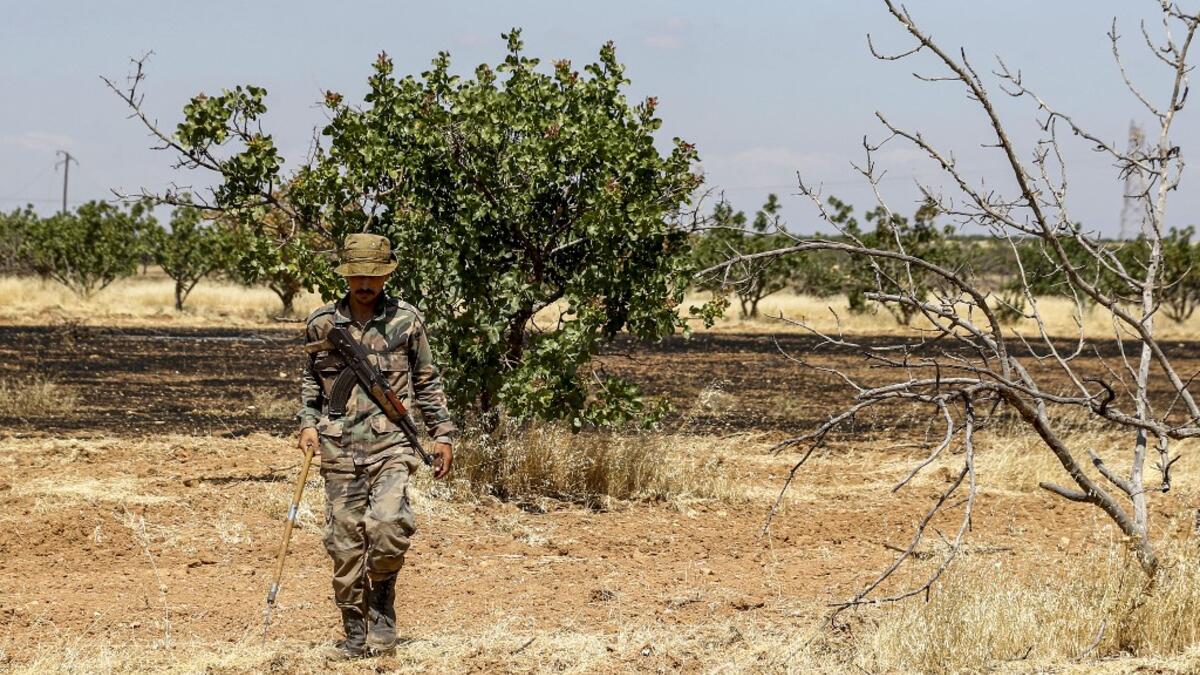 Maan, famed for its pistachio production, was controlled for years by jihadists and their rebel allies but it fell to the government at the start of the year following a months-long offensive. Although battles have died down, farmers in Hama are now grappling with landmines left behind by rebels and jihadists. LOUAI BESHARA / AFP