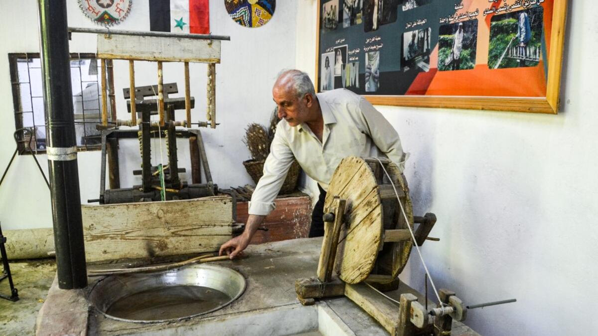 In the green hills of Deir Mama, Saud, his wife and three sons have been making silk for decades. They would raise silk worms in the spring, watching them munch on mulberry tree leaves and slowly build their thick cocoons, before spinning the thread and weaving those coils into fine cloth. MAHER AL MOUNES / AFP