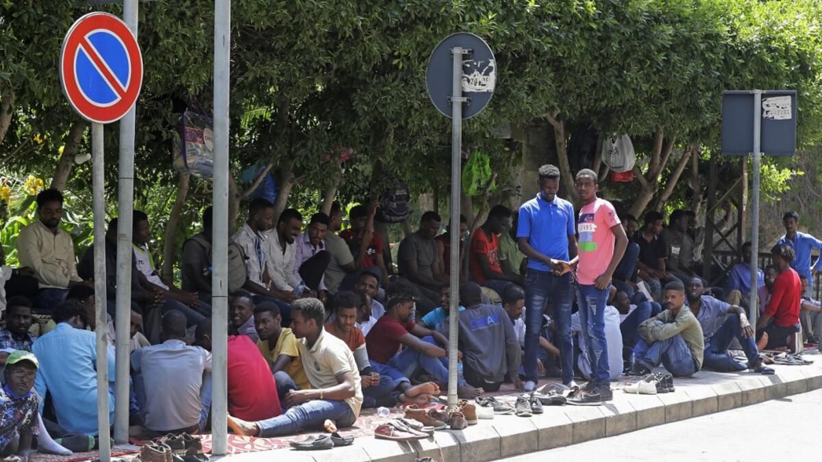 Sudanese workers, who lost their jobs due to the deteriorating economic situation in Lebanon, protest outside their county's embassy in Beirut to demand repatriation, on July 2, 2020. JOSEPH EID / AFP