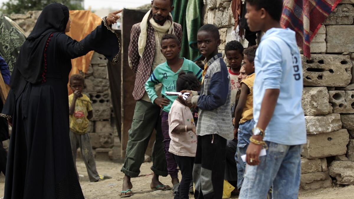 Members of Yemen's minority group known as "Muhamasheen" -- literally the "Marginalised" are pictured at a slum in the capital Sanaa on July 4, 2020. At a time when the Black Lives Matter movement is reshaping societies, black Yemenis have scant hope for an end to centuries of discrimination that has only worsened during the civil war. In Sanaa, members of the minority group known as "Muhamasheen" live in dismal conditions in densely populated slums. They count among the poorest of the poor in the Arab worl