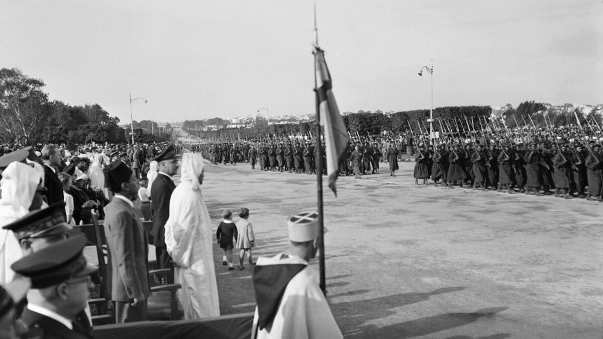 People and officials, in which Moulay Hassan (L), future king of Morocco Hassan II, attend the ceremonies of commemorations marking the anniversary of the 11 November 1918 armistice, in November 1945, in Rabat, Morocco. AFP