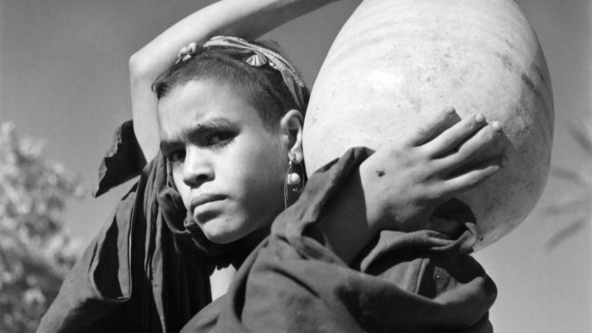 Portrait of a young woman who went to fetch water in a wadi, in the Tafilalet region, southern Morocco, in October 1945. AFP