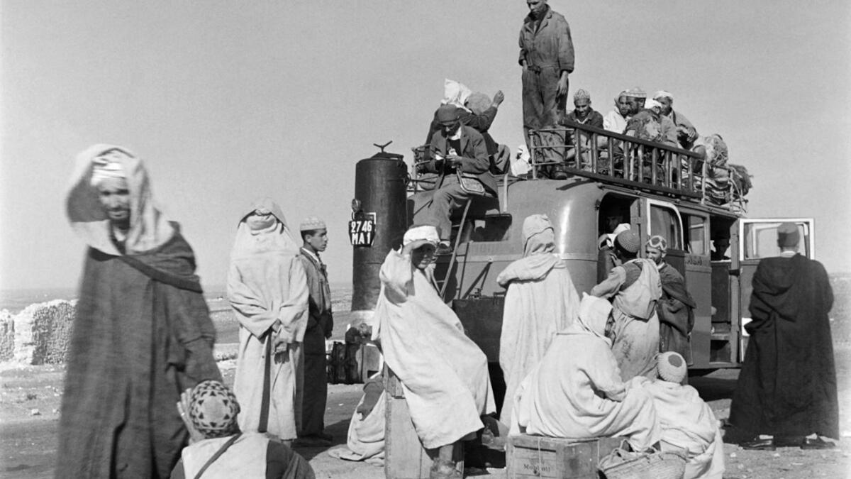 Men load their luggage onto a van, in November 1945 in Agadir, Morocco. AFP