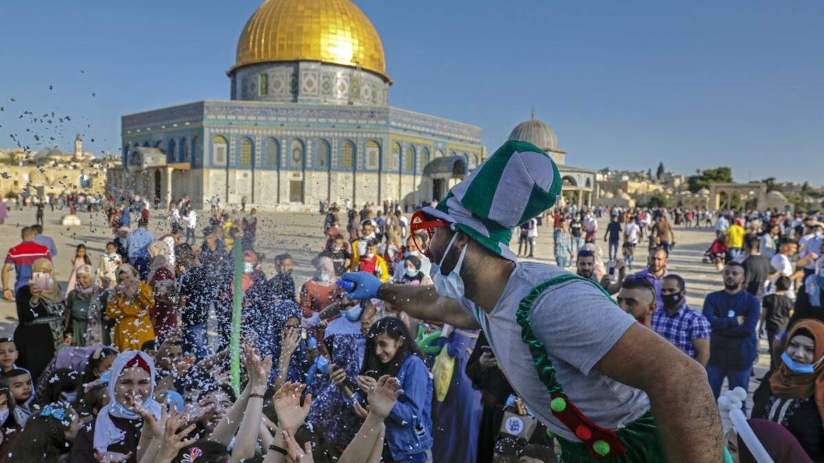 Palestinian Muslim worshippers gather at the al-Aqsa Mosque compound in Jerusalem's old city on the first day of Eid al-Adha on July 31, 2020. Eid al-Adha (the Festival of Sacrifice) is celebrated throughout the Muslim world as a commemoration of Abraham's willingness to sacrifice his son for God, and cows, camels, goats and sheep are traditionally slaughtered on the holiest day AHMAD GHARABLI / AFP