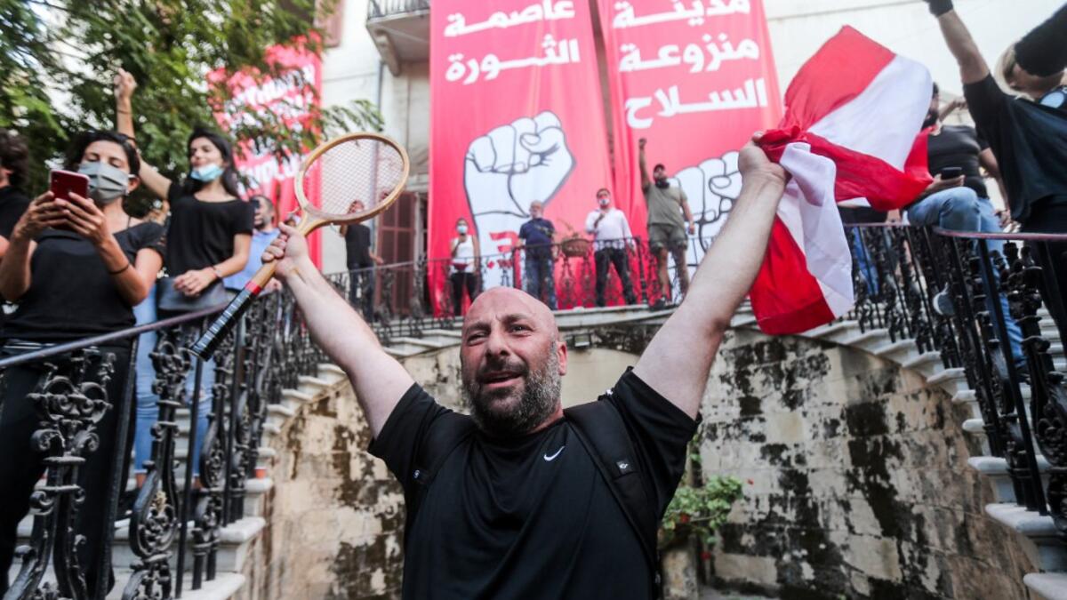 Lebanese protesters gather in the courtyard of the Ministry of Foreign Affairs in Beirut on August 8, 2020, after they stormed the headquarters as anger exploded over a deadly blast that made hundreds of thousands homeless and shocked the world. STR / AFP