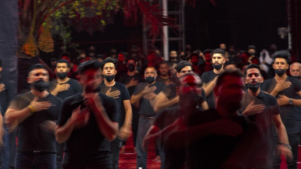Iraqis respect social distancing at a mosque on August 20, 2020, as Muslim Shiites start marking Ashura under new health guidelines to limit the risk of exposure to Covid-19 virus. Hussein FALEH / AFP