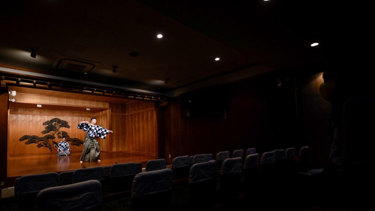 This photo taken on July 29, 2020 shows performer Kennosuke Nakamori (R) and his father Kanta Nakamori taking part in a rehearsal at the Kamakura Noh Theatre in the town of Kamakura in Kanagawa Prefecture, about one hour southwest of Tokyo. Philip FONG / AFP