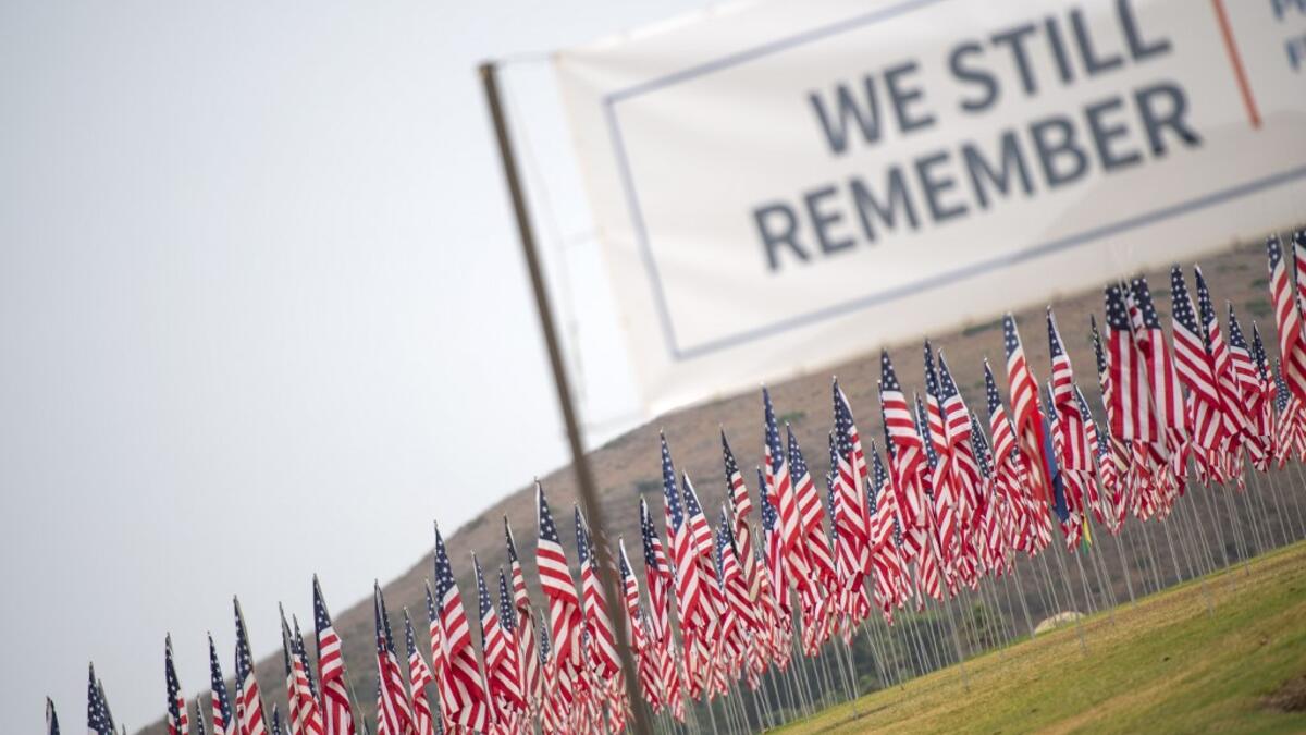 Some 3,000 flags comprise a 9/11 memorial at Pepperdine University in Malibu, California, on September 11, 2020, as the US commemorates the 19th anniversary of the attacks. Each flag represents a victim and their nationality. VALERIE MACON / AFP