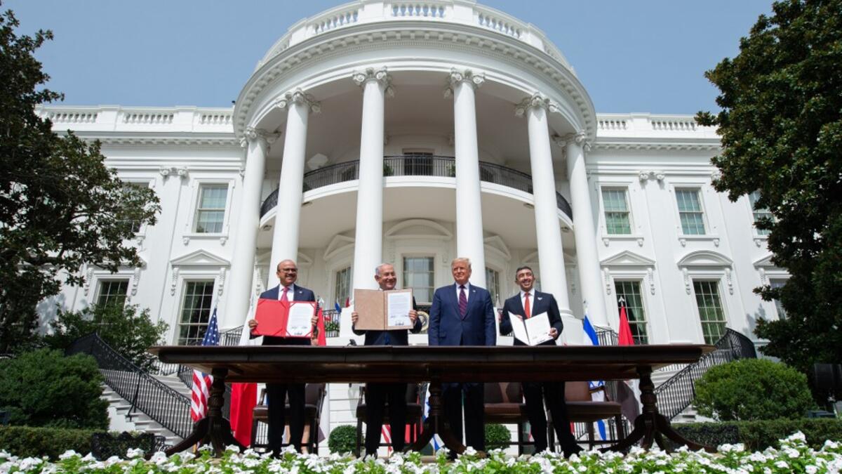 (L-R) Bahrain Foreign Minister Abdullatif al-Zayani, Israeli Prime Minister Benjamin Netanyahu, US President Donald Trump, and UAE Foreign Minister Abdullah bin Zayed Al-Nahyan hold up documents after participating in the signing of the Abraham Accords where the countries of Bahrain and the United Arab Emirates recognize Israel, at the White House in Washington, DC, September 15, 2020.
