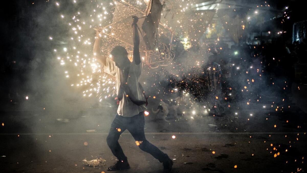 A member of the Afro-Mexican community carries a "toritol" of fire in the annual festival dedicated to San Nicolas Tolentino, in Cuajinicuilapa, Guerrero state, Mexico, on September 9, 2020, amid the COVID-19 coronavirus pandemic. Although there are 1,5 million African descendants in a country of 128 million inhabitants, it is normal to hear that "in Mexico there are no blacks". PEDRO PARDO / AFP