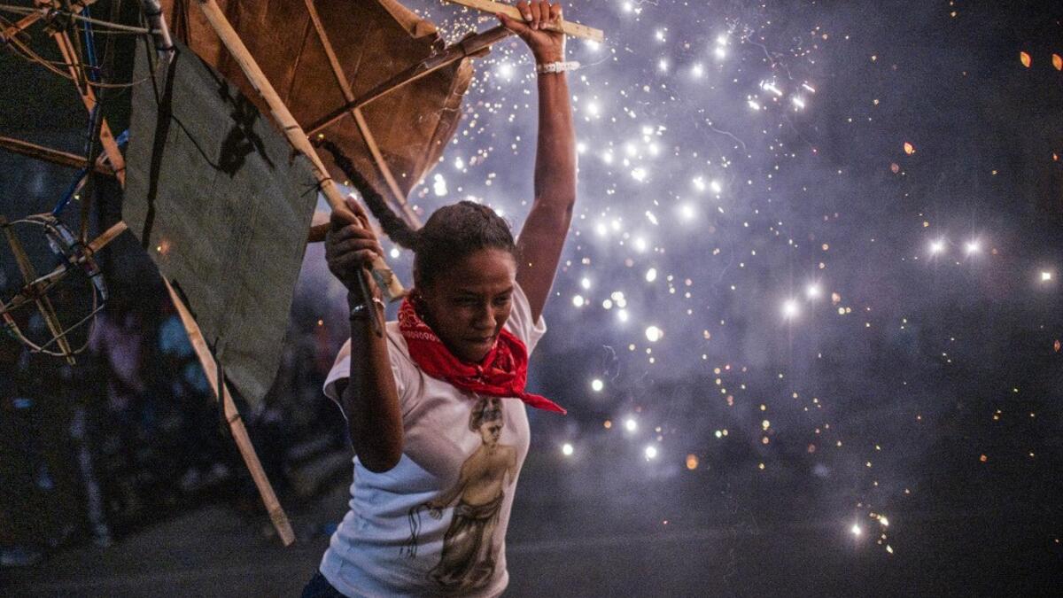 A member of the Afro-Mexican community carries a "toritol" of fire during the annual festival dedicated to San Nicolas Tolentino, in Cuajinicuilapa, Guerrero state, Mexico, on September 9, 2020, amid the COVID-19 coronavirus pandemic. Although there are 1,5 million African descendants in a country of 128 million inhabitants, it is normal to hear that "in Mexico there are no blacks". PEDRO PARDO / AFP