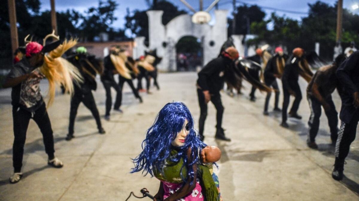 Teenagers, members of the Afro-Mexican community, make Los Diablos dance, at El Pitayo community in Cuajinicuilapa, Guerrero state, Mexico, on September 10, 2020, amid the COVID-19 coronavirus pandemic. Although there are 1,5 million African descendants in a country of 128 million inhabitants, it is normal to hear that "in Mexico there are no blacks". PEDRO PARDO / AFP