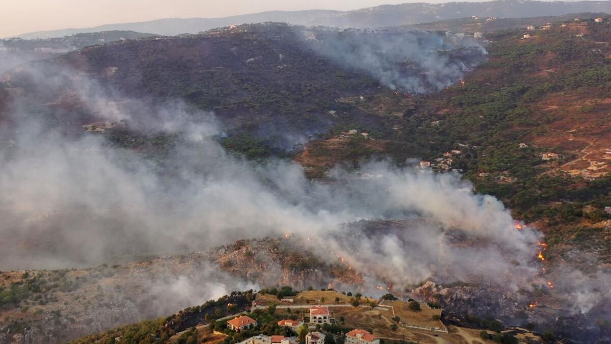 An aerial picture shows smoke billowing from a forest fire in Lebanon's Ras El Metn area, on October 10, 2020. AFP