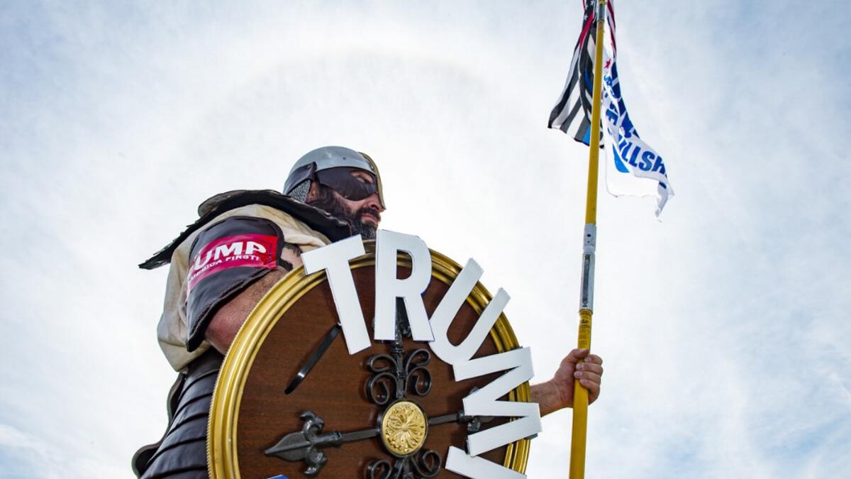 A contestant dressed as a viking version of President Trump poses for a portrait during a Trump campaign rally named "Trumptoberfest" at Rocky Point Park in Warwick, Rhode Island on October 11, 2020. Many supporters dressed in political campaign clothing and waved flags while others dressed in festive costumes to take part in a political costume contest. Joseph Prezioso / AFP