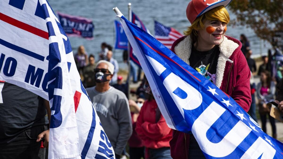 A contestant dressed as a Donald Trump Pokemon trainer participates in a Trump campaign rally named "Trumptoberfest" at Rocky Point Park in Warwick, Rhode Island on October 11, 2020. Many supporters dressed in political campaign clothing and waved flags while others dressed in festive costumes to take part in a political costume contest. Joseph Prezioso / AFP