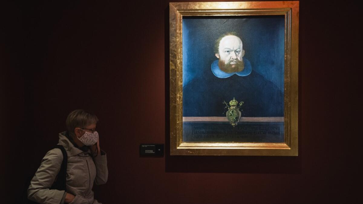 The Witch Burner is displayed as a woman visits the HEX!, a museum of Witch Hunt, on October 1, 2020 in Ribe, Denmark. Located in the home of a former witch hunter, the Hex! Museum of Witch Hunt sheds light on how a fear of witches led to persecutions that swept across Denmark and Europe in the 16th and 17th centuries. Jonathan NACKSTRAND / AFP