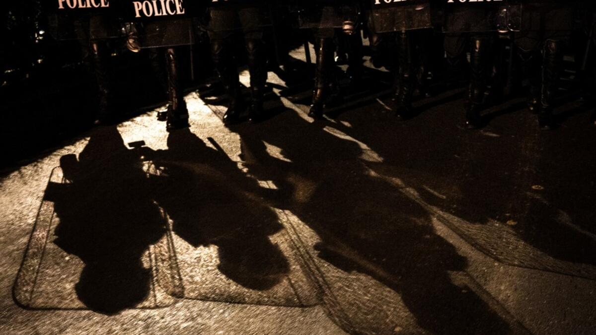 Riot police prepare to disperse pro-democracy protesters in Bangkok on October 15, 2020, after Thailand issued an emergency decree following an anti-government rally the previous day. Sirachai ARUNRUGSTICHAI / AFP