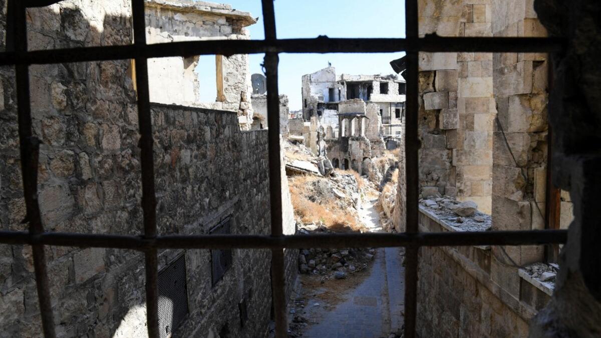 Syrian workers take part in the reconstruction of Martini restaurant and hotel in the Jdaideh neighbourhood in Aleppo's Old City on October 17, 2020. AFP
