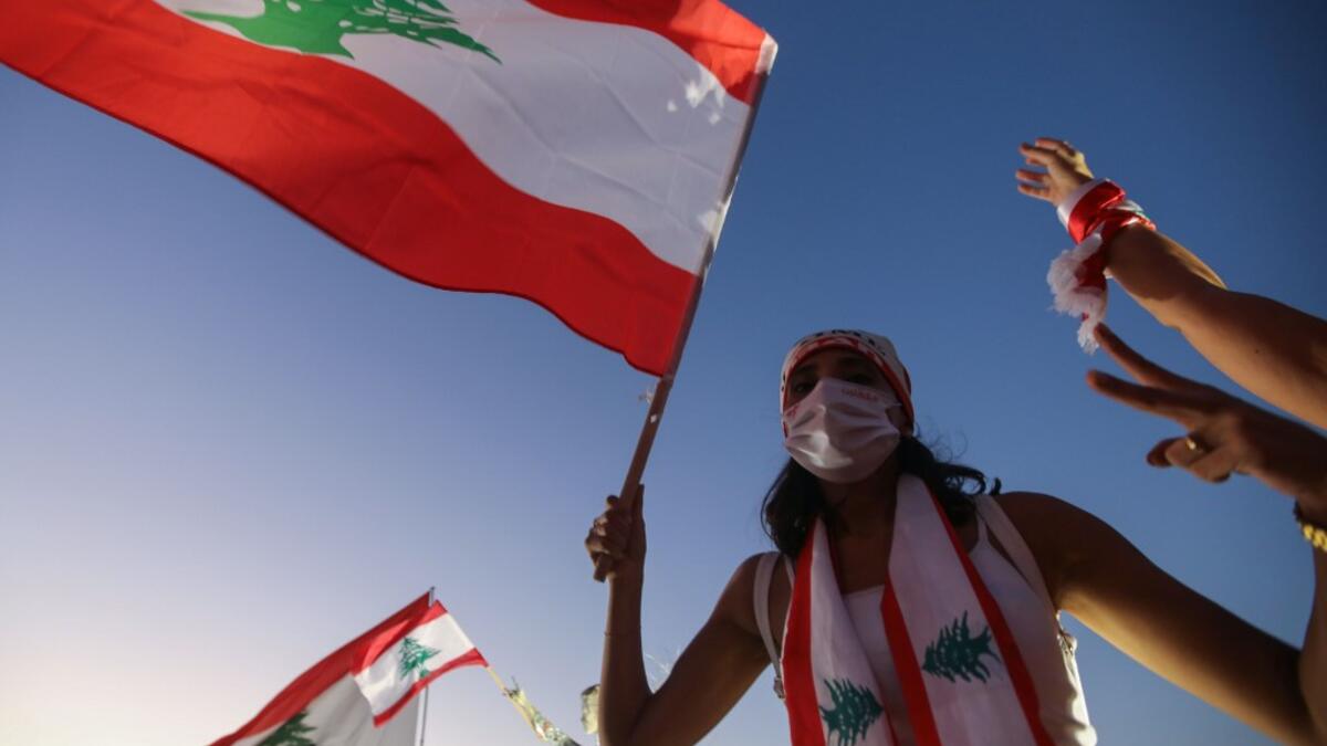 Hundreds marched in Lebanon's capital to mark the first anniversary of a non-sectarian protest movement that has rocked the political elite but has yet to achieve its goal of sweeping reform. ANWAR AMRO / AFP