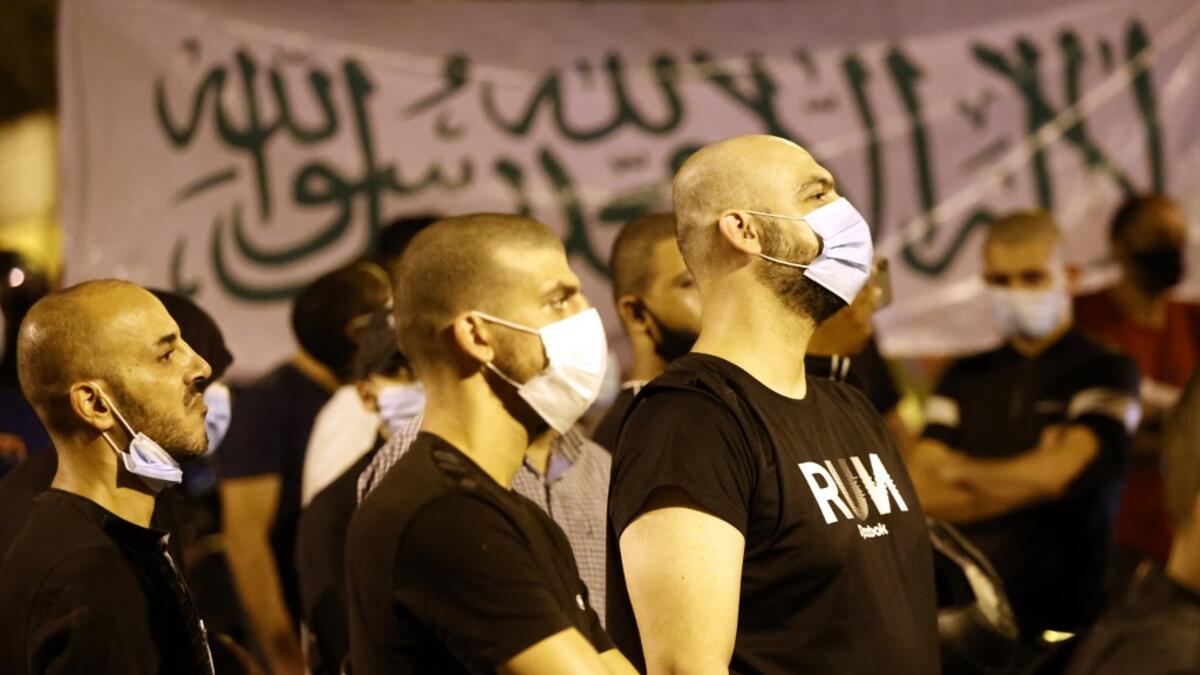 Arab-Israeli protesters gather outside the residence of the French Ambassador to Israel, in Tel Aviv on October 24, 2020, in response to comments by French President Emmanuel Macron defending cartoons of the Prophet Mohammed. JACK GUEZ / AFP
