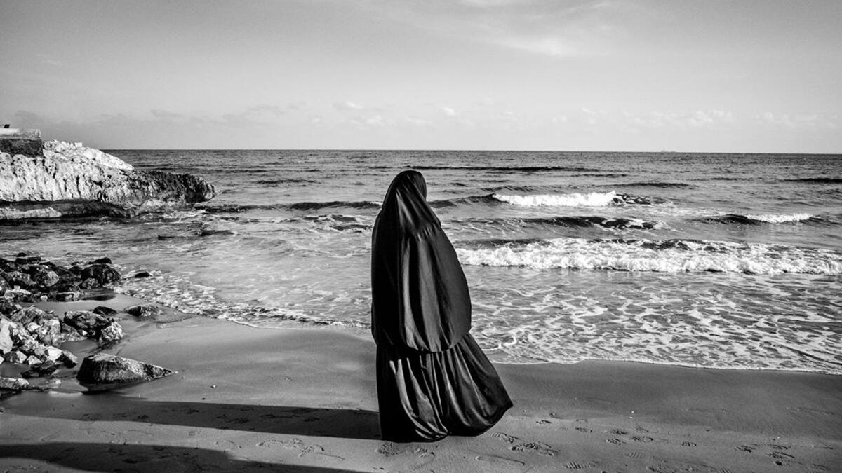 A Syrian woman looks at the sea near Mersin, on the Western coast of Turkey, on 29 January 2015.⁣ From ‘The Dream’ by Fabio Bucciarelli (@fabio_bucciarelli).⁣ (Instagram)