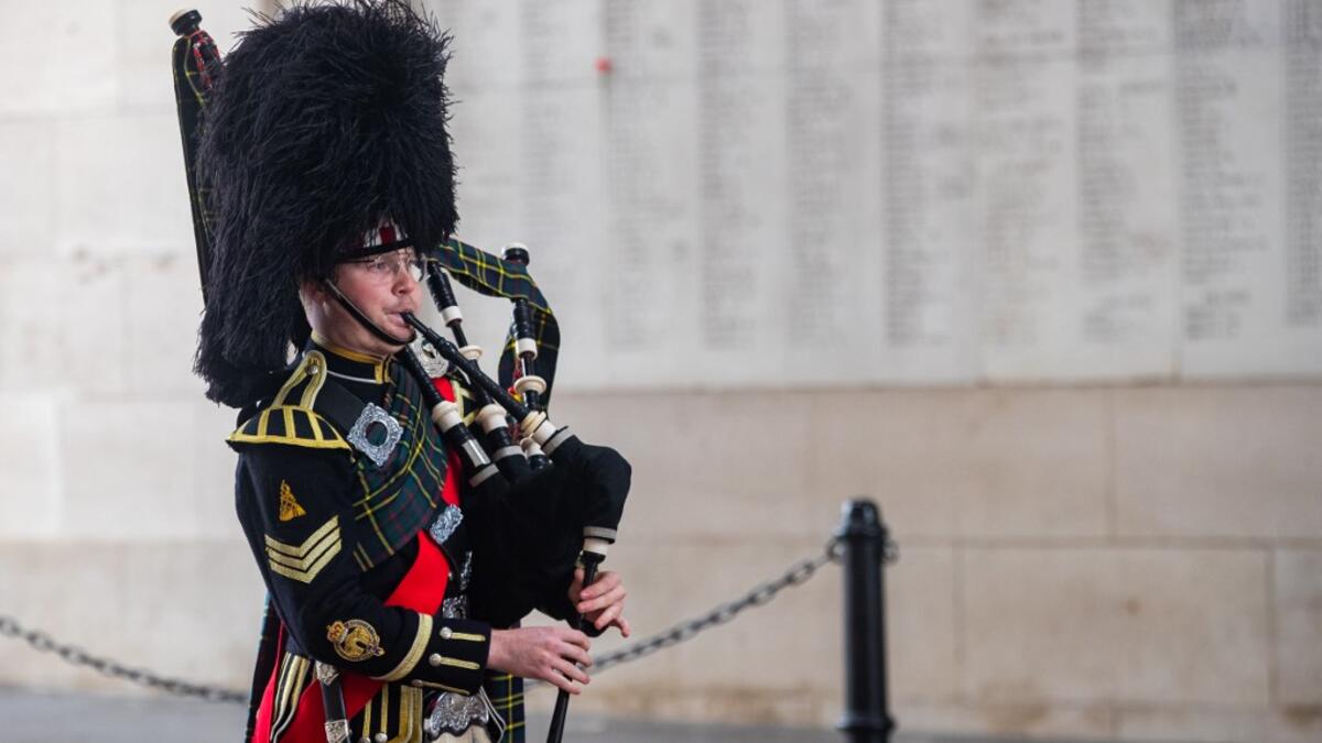 Belgian piper Gil Vermeulen plays the pipes during the Last Post ceremony at the Commonwealth War Graves Commission Ypres Memorial at the Menin Gate in Ypres on November 11, 2020 on the occasion of the commemorations marking the 102nd anniversary of the November 11, 1918 Armistice, ending World War I (WWI). Kurt DESPLENTER / BELGA / AFP
