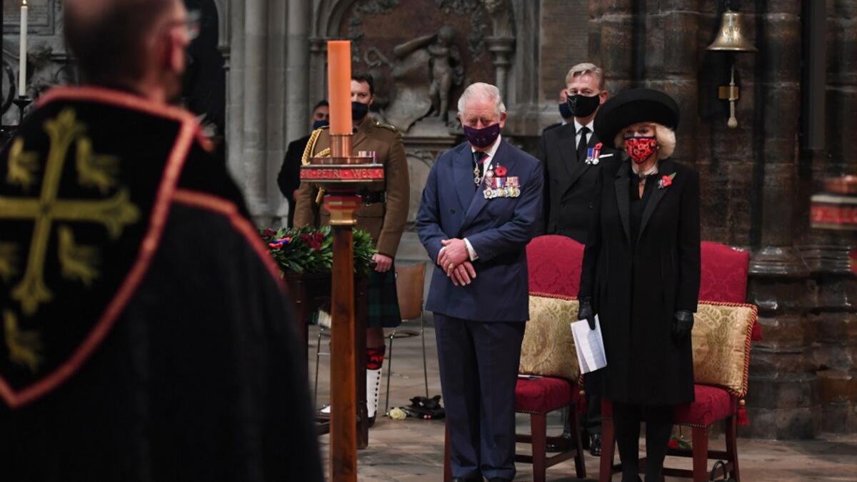 Britain's Prince Charles, Prince of Wales and Britain's Camilla, Duchess of Cornwall participate in a service to commemorate the centenary of the burial of the Unknown warrior at Westminster Abbey on Armistice day in London on November 11, 2020. Jeremy Selwyn / POOL / AFP