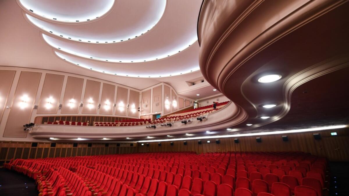 A picture taken on November 19, 2020 shows the Lichtburg cinema in Essen, western Germany. The Lichtburg, which was built 1928, is a historical cinema with 1250 seats and is the largest cinema hall in Germany. No public events will take place at theaters until December, 2020 to limit the spread of the novel coronavirus. Ina FASSBENDER / AFP