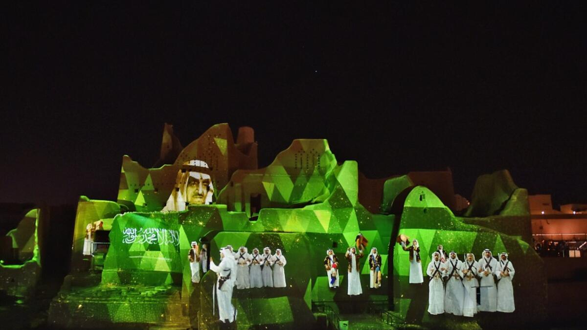 An animation is projected at the historical site of al-Tarif in Diriyah district, on the outskirts of Saudi capital Riyadh, on November 20, 2020. Saudi Arabia hosts the G20 summit on November 21 in a first for an Arab nation, with the downsized virtual forum dominated by efforts to tackle a resurgent coronavirus pandemic and crippling economic crisis. FAYEZ NURELDINE / AFP
