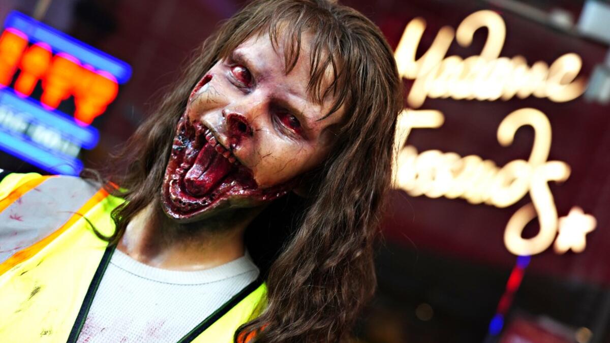 A zombie figure is displayed outside of Madame Tussauds for Halloween on October 31, 2020 in New York City. Many Halloween events have been canceled or adjusted with additional safety measures due to the ongoing coronavirus (COVID-19) pandemic. Cindy Ord/Getty Images/AFP