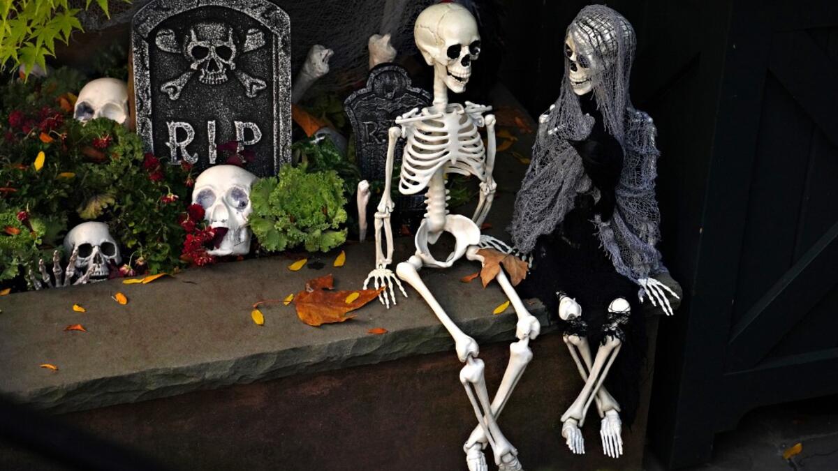 An Upper East Side home is decorated with skeletons for Halloween on October 31, 2020 in New York City. Many Halloween events have been canceled or adjusted with additional safety measures due to the ongoing coronavirus (COVID-19) pandemic. Cindy Ord/Getty Images/AFP