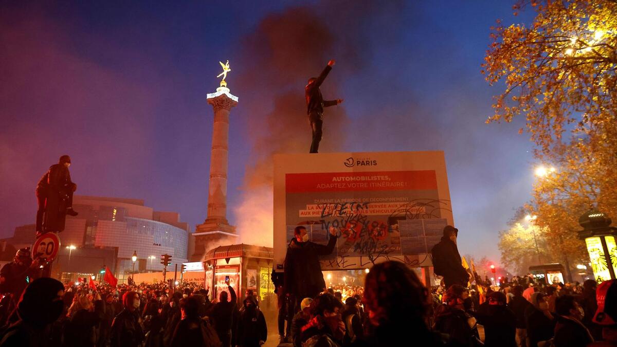 Demonstrators in Paris protest on Saturday France's "global security" draft law. Photo: Thomas Coex/AFP via Getty Images