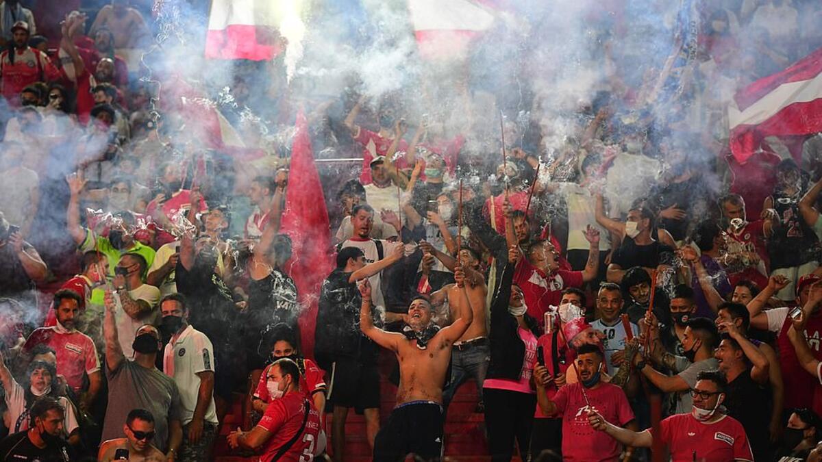 Grieving fans let off flares at the Argentinos Juniors stadium where Maradona began his professional career in the 1970s. (AFP/File)