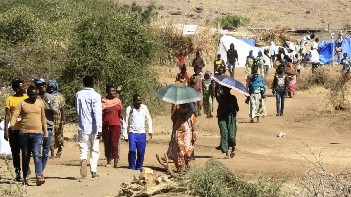 Ethiopian refugees who fled the fighting in Tigray Region are pictured at Umm Rakuba camp in eastern Sudan's Gedaref State, on November 30, 2020. ASHRAF SHAZLY / AFP