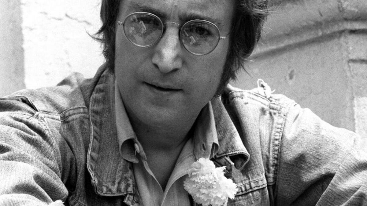 In this file photo taken on May 17, 1971 music legend John Lennon poses for photographers in Cannes 17 May 1971 where he presented his movies 'Apotheosis' and 'The Flu'. John Lennon's career was cut short 40 years ago, on December 8, 1980, when he was shot dead in New York. AFP
