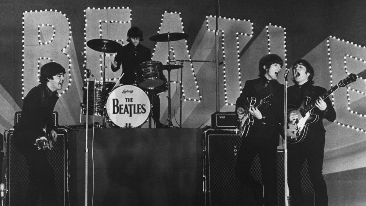 In this file photo taken on June 29, 1966 This photo taken on June 30, 1966 shows British band The Beatles, (L to R) Paul McCartney, Ringo Starr, George Harrison and John Lennon, performing during their concert at the Budokan in Tokyo. John Lennon's career was cut short 40 years ago, on December 8, 1980, when he was shot dead in New York. JIJI PRESS / AFP