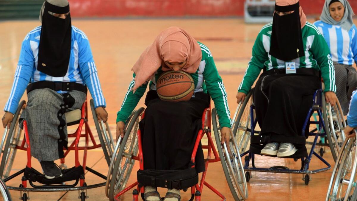 Disabled Yemeni women take part in a local wheelchair basketball championship in Yemen's capital Sanaa on December 8, 2020. In conflict-ridden Yemen, nine teams, including five-all women groups, competed in a local championship for the disabled in the capital Sanaa, which has been under rebel control since 2014. The players are competing to be embraced by society for their strengths rather than be viewed as a burden during the time of war. Mohammed HUWAIS / AFP