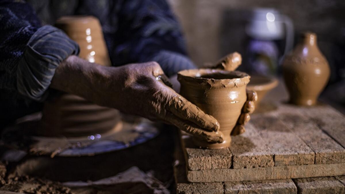 Petros was only a teenager when he had to take over for his sick father and become the main potter of the family. He has since become a master of the craft, and is keen to pass his skills on.  Delil SOULEIMAN / AFP
