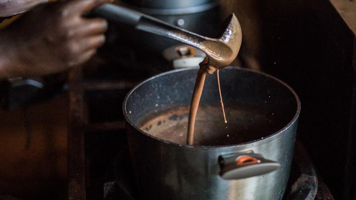 Preparation of hot chocolate drink is done in the workshops of Makaya Chocolat on December 23, 2020 in Petionville, Haiti. Although small in the face of South America's giants, Haiti is slowly developing its cocoa industry to ensure better incomes for thousands of modest farmers and to end the stereotype of gastronomic art known as the domain of wealthy countries. Valerie Baeriswyl / AFP
