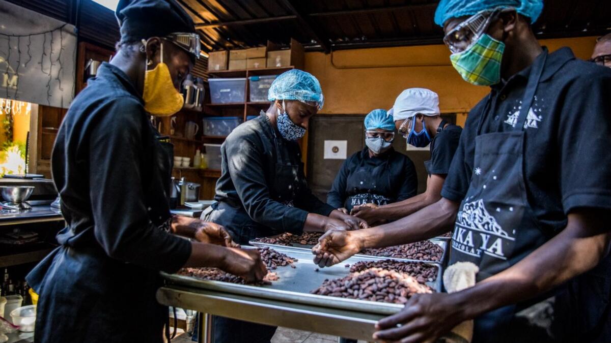Sorting of cocoa beans according to their size and appearance is done in the workshops of Makaya Chocolat on December 23, 2020 in Petionville, Haiti. Although small in the face of South America's giants, Haiti is slowly developing its cocoa industry to ensure better incomes for thousands of modest farmers and to end the stereotype of gastronomic art known as the domain of wealthy countries. Valerie Baeriswyl / AFP