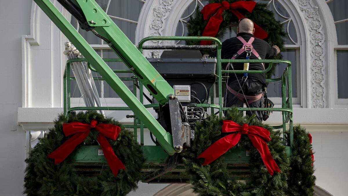 Christmas wreaths are installed at the White House on November 25, 2020 in Washington, DC. The White House is still planning Holiday parties despite federal and state warning about Covid-19 in the middle of a pandemic. Tasos Katopodis/Getty Images/AFP