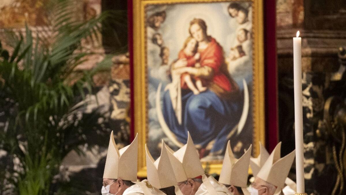 Clergy, celebrates a new year Mass in St. Peter's Basilica at the Vatican on January 1, 2021. Alessandra Tarantino / POOL / AFP